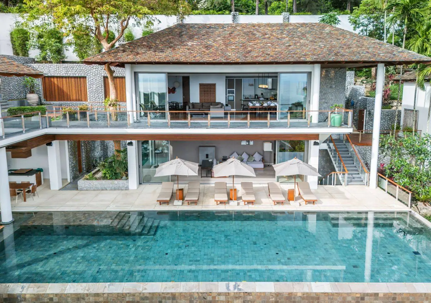 The two levels of open living pavilions at Baan Banyan Villa above the pool terrace