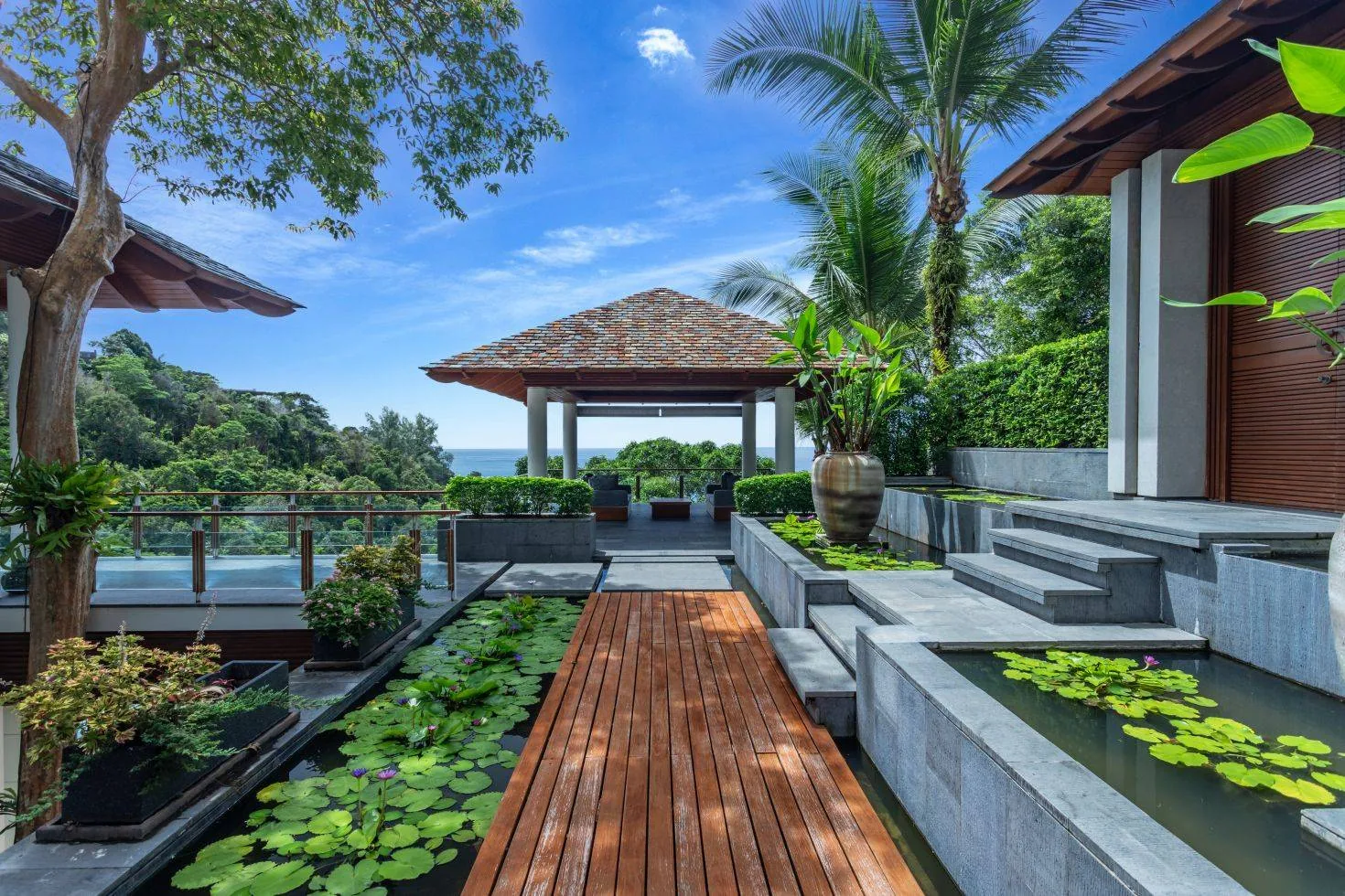 A walkway beside a garden path with a sea view